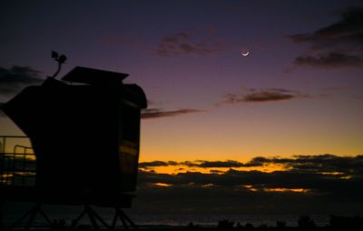 Silhouette built structure against sky during sunset