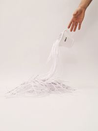 Cropped image of hand holding over white background