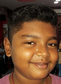 Close-up portrait of a smiling young man