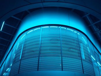 Low angle view of illuminated modern building in city at night