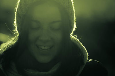 Close-up portrait of a smiling young woman