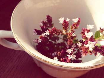 Close-up of flowers in bowl on table