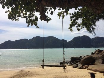Scenic view of mountains against cloudy sky