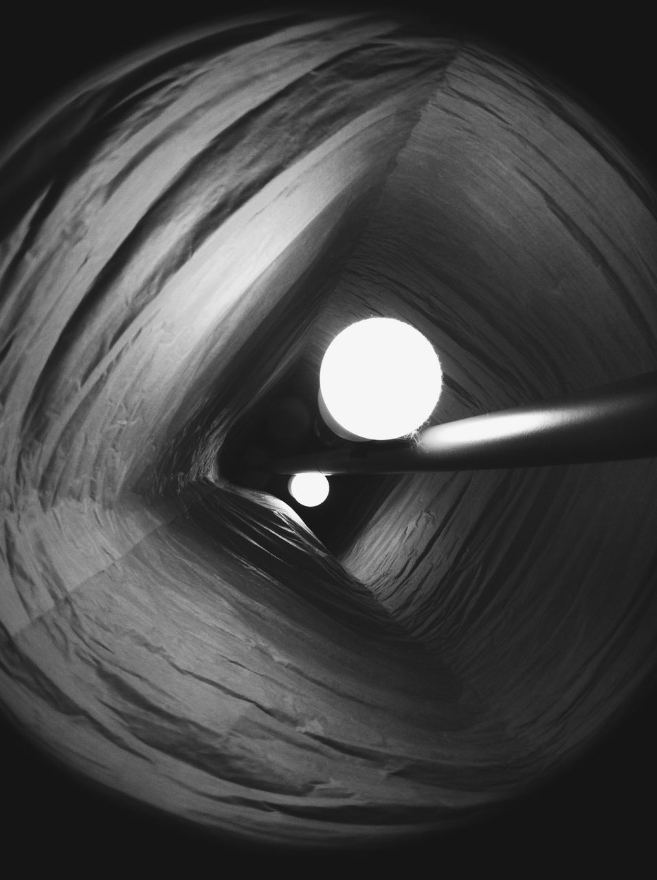 circle, close-up, indoors, one person, black background, studio shot, hole, part of, detail, dark, human eye, abstract, macro, cropped, extreme close-up, night, geometric shape, shape, light - natural phenomenon