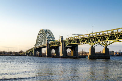 Bridge over river against clear sky