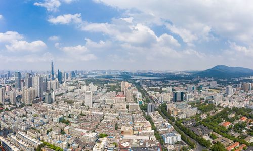 High angle view of city buildings against sky