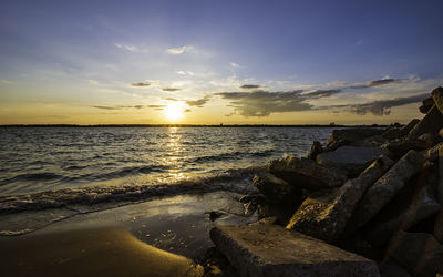 Scenic view of sea against sky during sunset