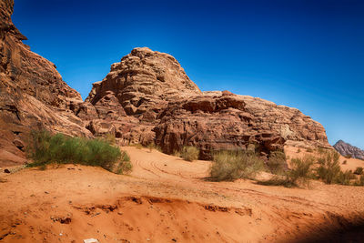 Rock formations on landscape against clear sky