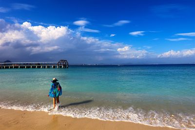 Woman standing on beach