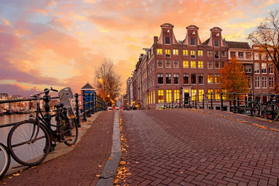 City scenic from amsterdam at the amstel in the netherlands at sunset