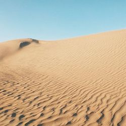 Scenic view of desert against clear sky