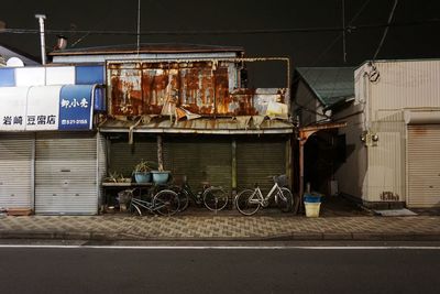 Bicycles parked against built structure