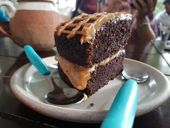 Slice of cake in plate on table