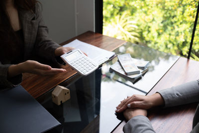 Midsection of man working in office