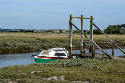 View of boat on grass against sky