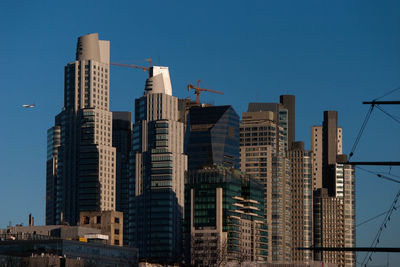 Low angle view of modern buildings against sky