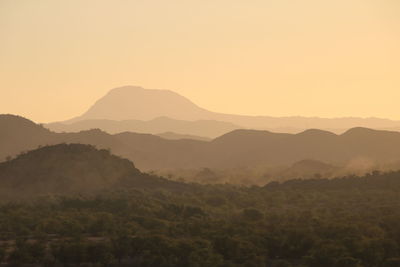 Scenic view of mountains against sky during sunset