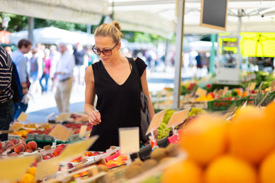 Beautiful woman standing in market