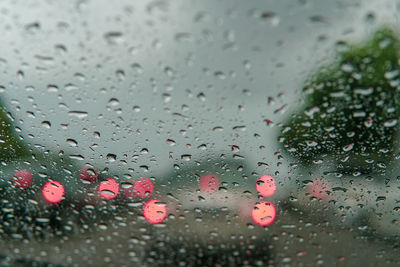 Raindrops on glass window during rainy season