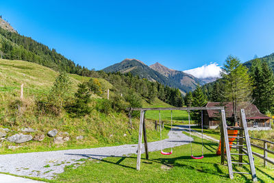 Scenic view of mountains against blue sky