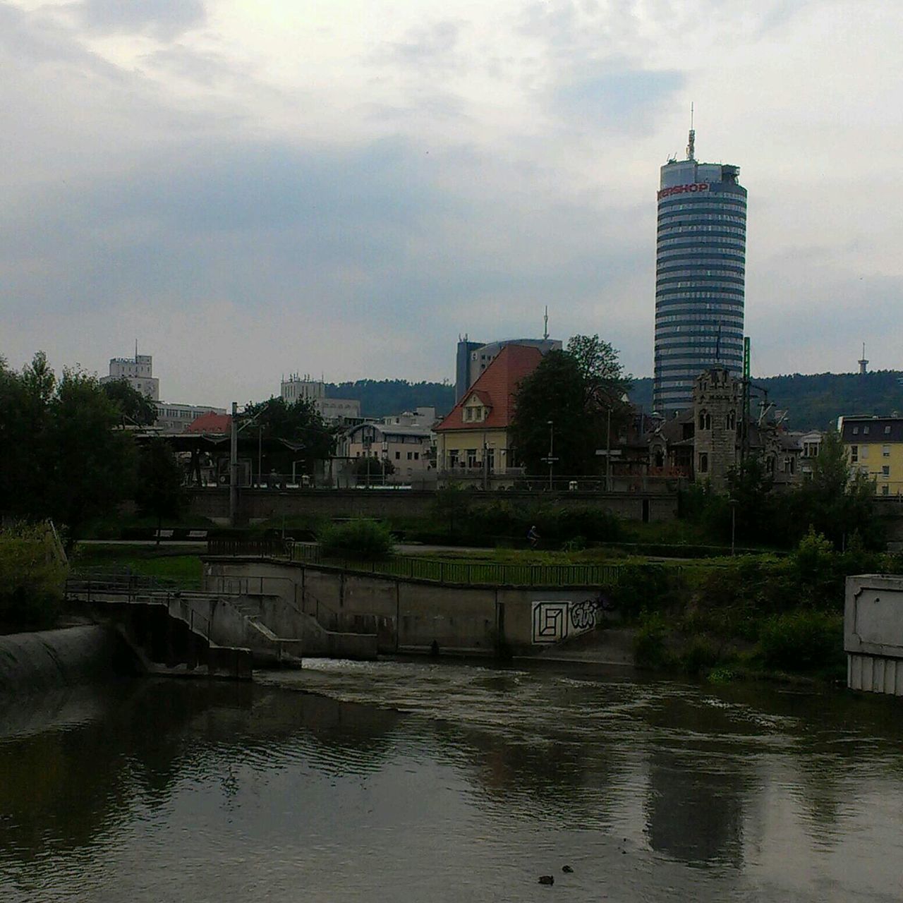 building exterior, architecture, built structure, water, sky, river, waterfront, city, tree, reflection, cloud - sky, building, residential building, residential structure, cloud, lake, canal, day, no people, outdoors