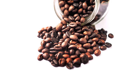 Close-up of coffee beans against white background