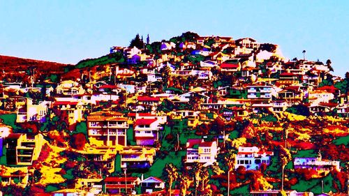 Residential buildings against blue sky