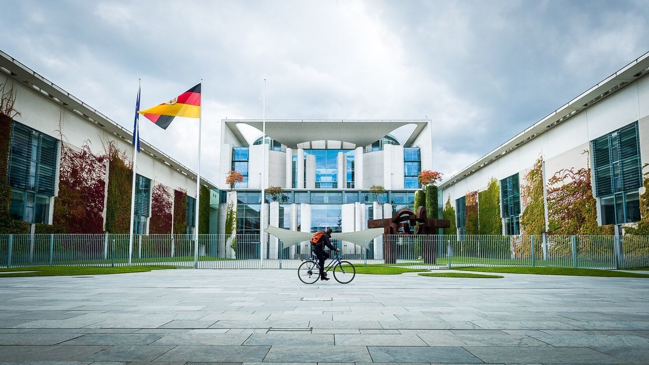 MAN ON BICYCLE IN CITY