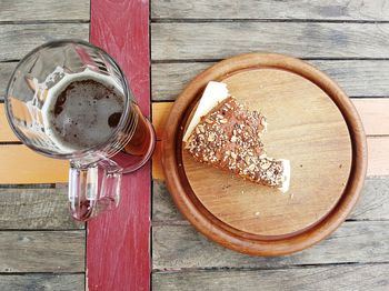 Directly above shot of food and drink on wooden table