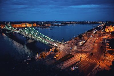 High angle view of illuminated bridge over river against sky