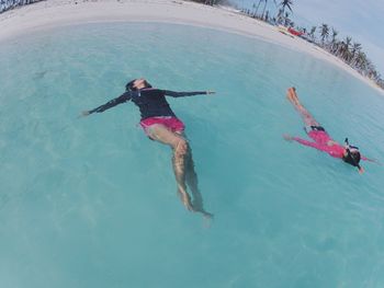 Woman jumping in water