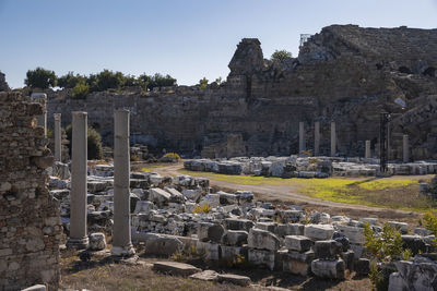 View of old ruined ancient temple of tyche at side, turkey