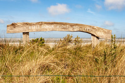 Old ruin on field against sky