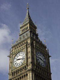 Low angle view of clock tower against sky