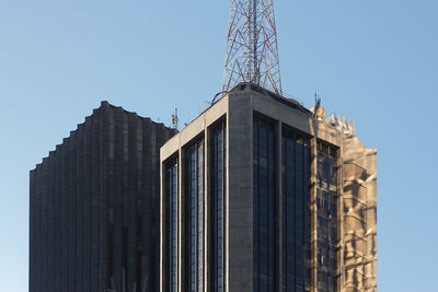 Low angle view of skyscraper against clear sky