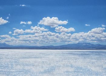 Scenic view of sea against blue sky