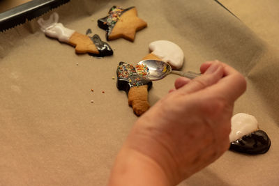 High angle view of person hand on table