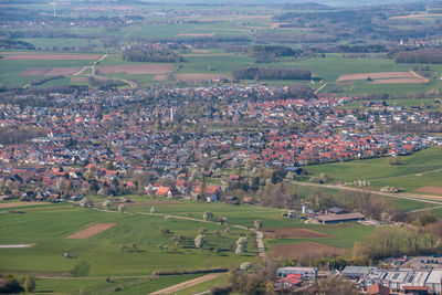 High angle view of field and buildings