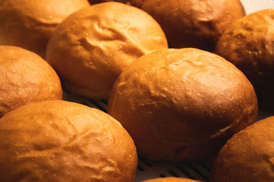 Close-up background of hot fresh hamburger buns. artisan buns