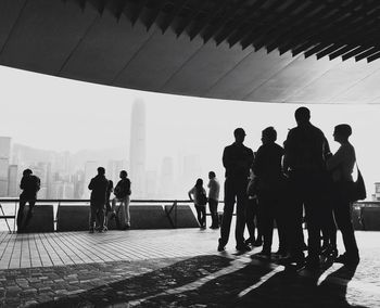 Silhouette of people on road