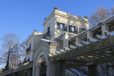 Low angle view of building against blue sky