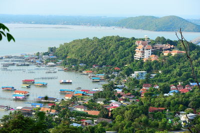 High angle view of townscape by sea