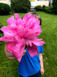 Close-up of pink flower on field