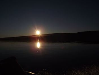 Scenic view of silhouette landscape against clear sky during sunset