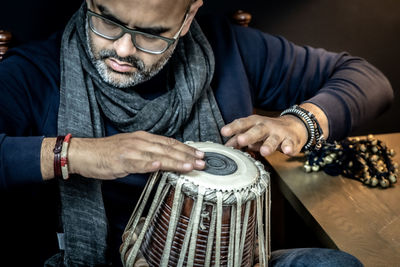 Close-up of man playing tabla