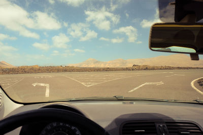 Road seen through car windshield