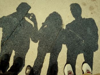 Low section of people standing on street