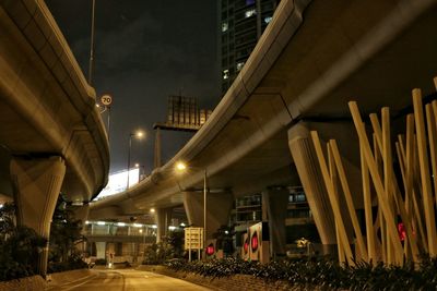 Illuminated bridges in city at night