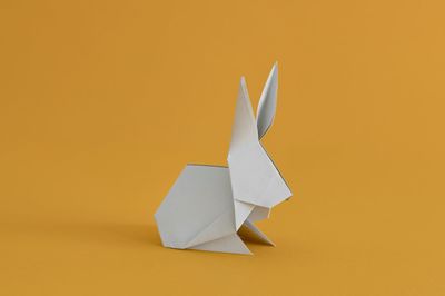 Artificial rabbit on orange background