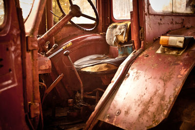 Old rusty car in garage